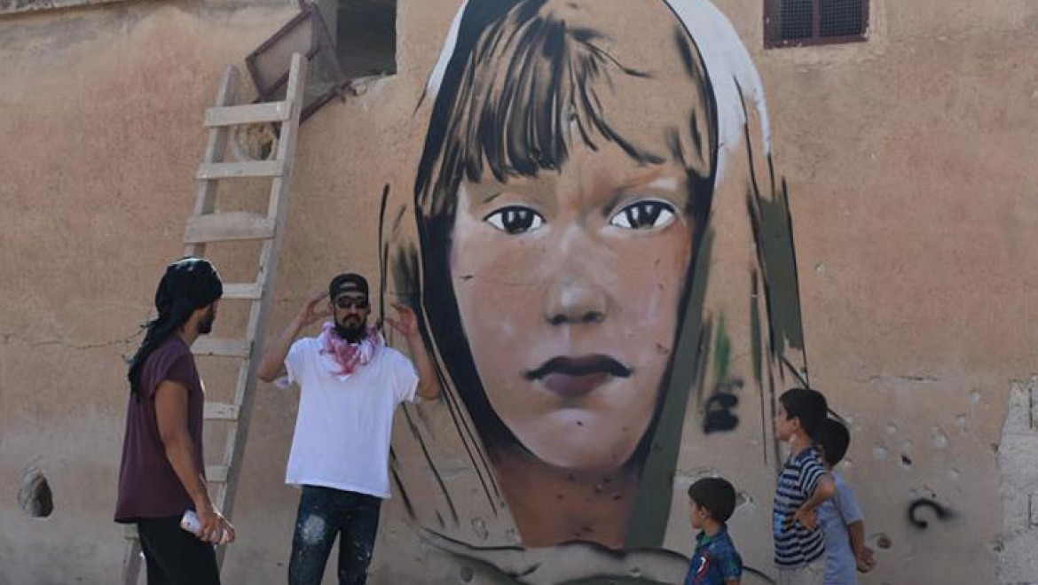 Türk grafiti sanatçılarından Suriye'de anlamlı çizimler