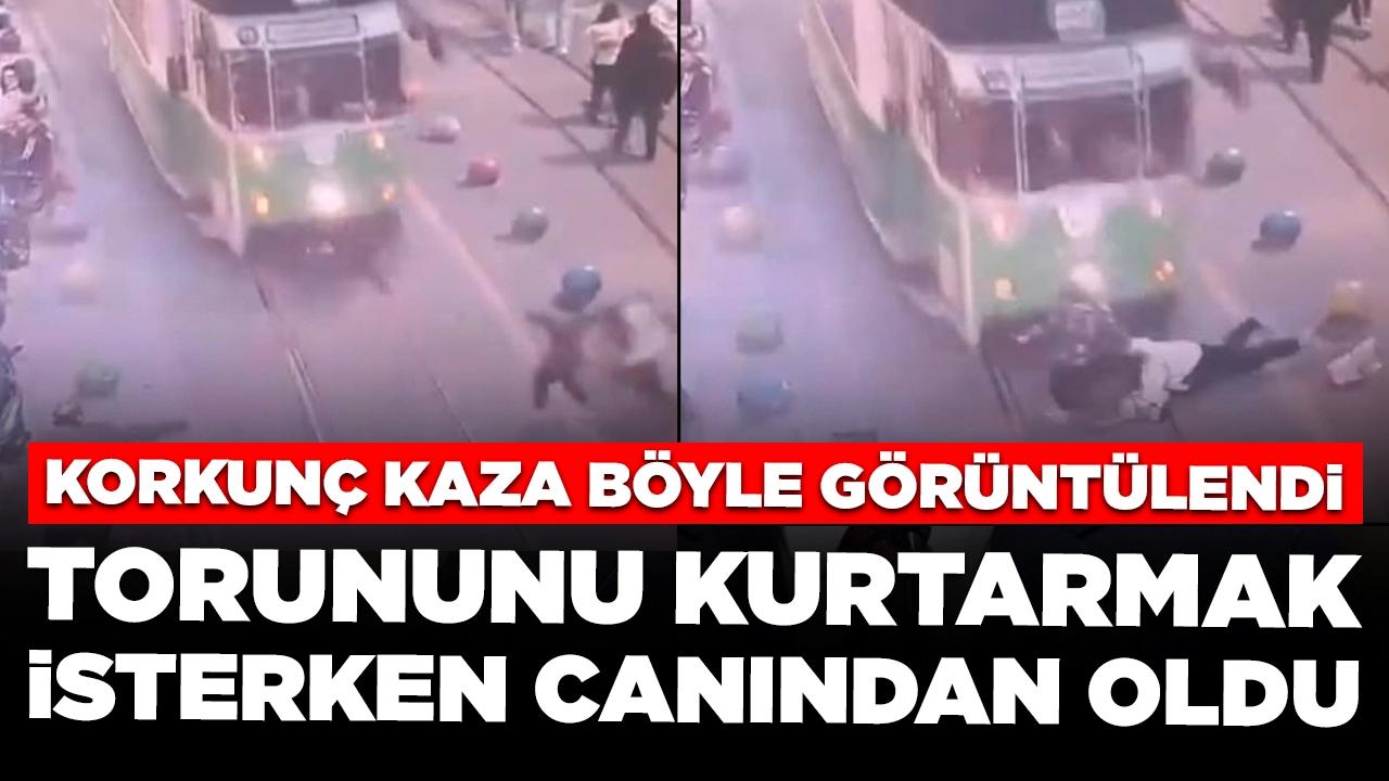 Torununu kurtarmak isterken tramvayın altında kaldı: Kaza anı böyle görüntülendi