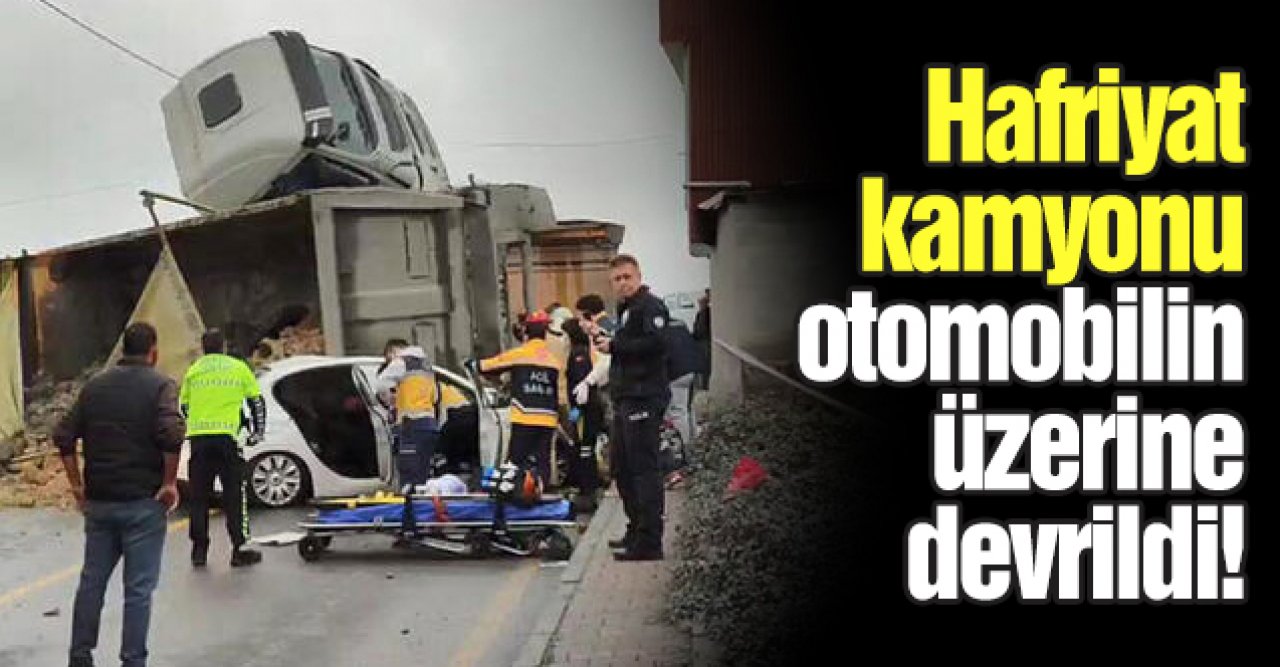 Başakşehir'de hafriyat kamyonu otomobilin üzerine devrildi