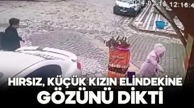 Hırsız şimdide küçük kızın elindekine göz dikti!