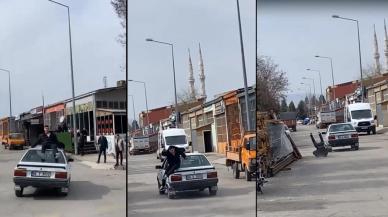 Otomobilin tavanında tehlikeli yolculuk kötü bitti: Kendini saniyeler sonra yerde buldu