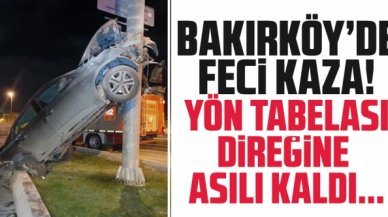 Fatih Günay otomobili ile Bakırköy'de yön tabelası direğine asılı kaldı