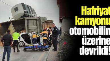 Başakşehir'de hafriyat kamyonu otomobilin üzerine devrildi