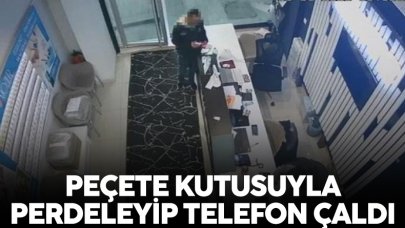 Peçete kutusu arkasından cep telefonu çalıp kaçtı